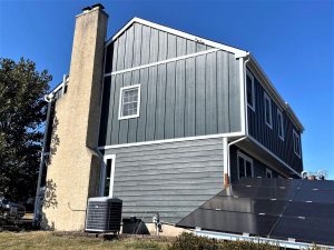 House with solar panels on a sunny day.