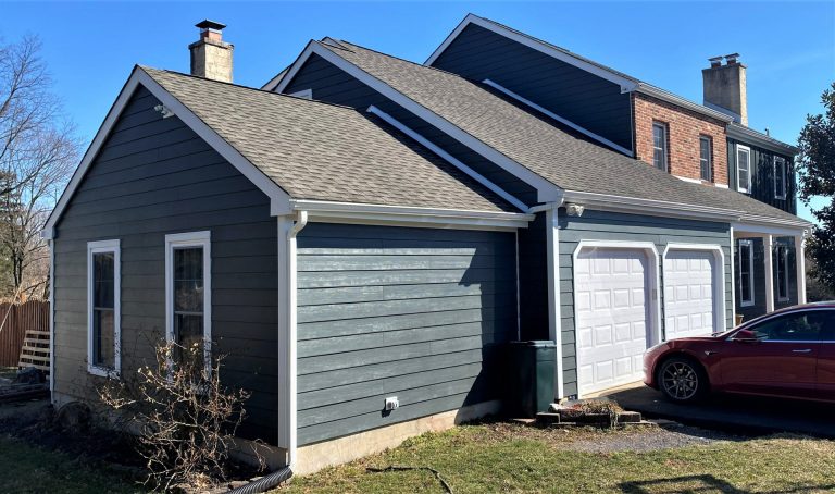 Blue house with garage and car