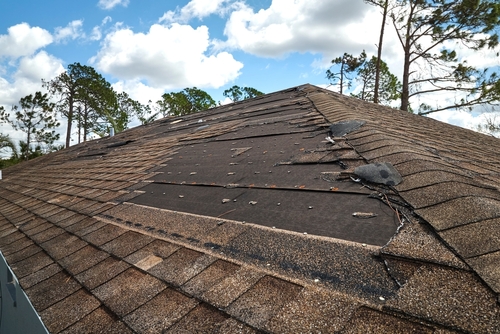 a damaged roof likely from huricane