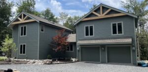 A gorgeous home showcasing newly installed muted blue siding.