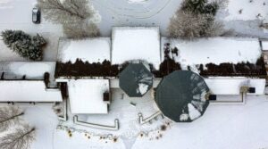 An aerial view of snowy rooftop.