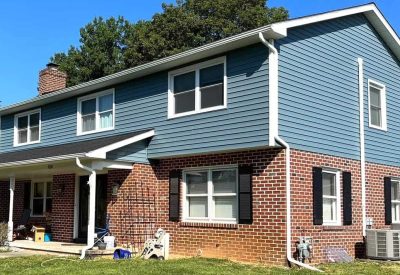 Remodeled home with new roofing and siding in Bethlehem, PA, showcasing quality construction and cur.