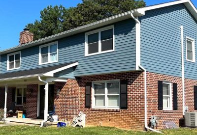 Exterior home renovation with new roofing and siding by Kesting Construction. Expert craftsmanship i.