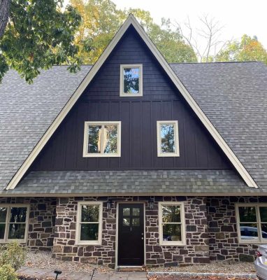 Modern home with new window and siding installation for enhanced curb appeal.