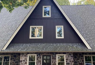 Modern home with new window and siding installation for enhanced curb appeal.